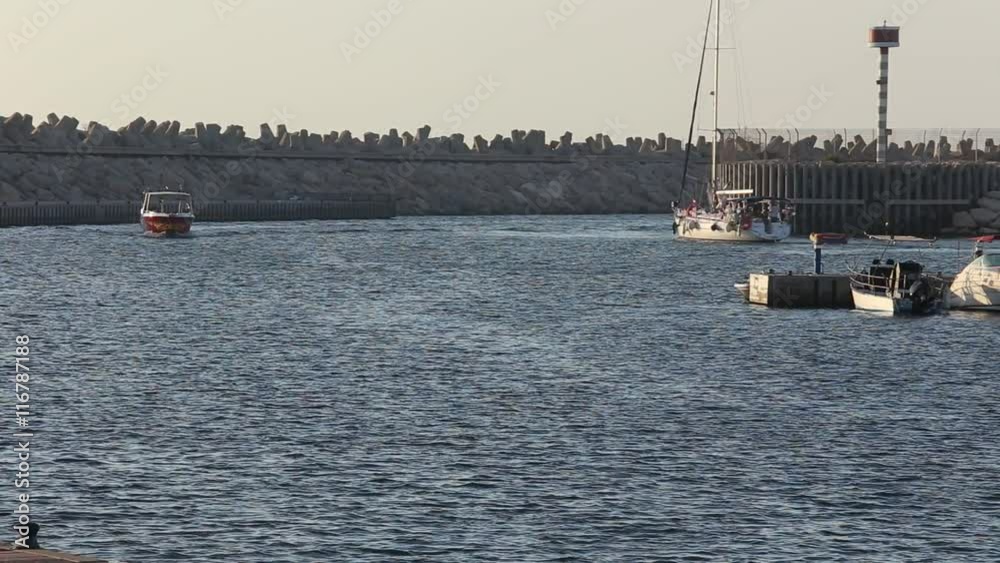 Boats come and go in the harbor. Yacht Club.Ashdod Israel Boats come and go in the harbor. Yacht Club.Ashdod Israel