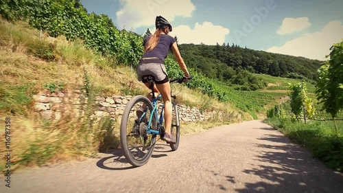 Young woman riding her mountain bike