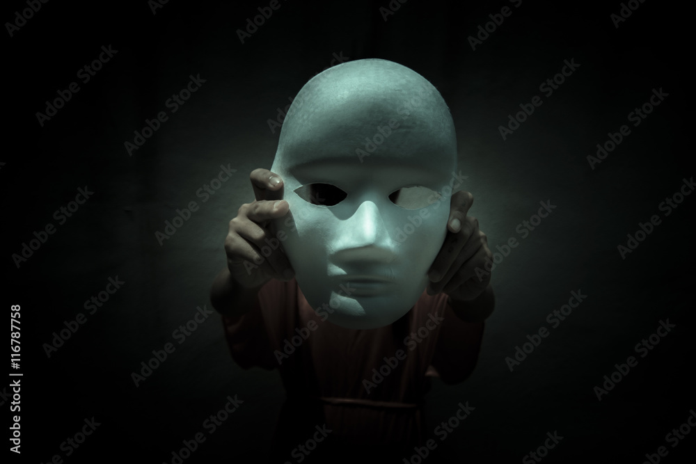 Mysterious person showing white mask in the dark,Scary background for book  cover Stock Photo by ©lighthouse 117934264