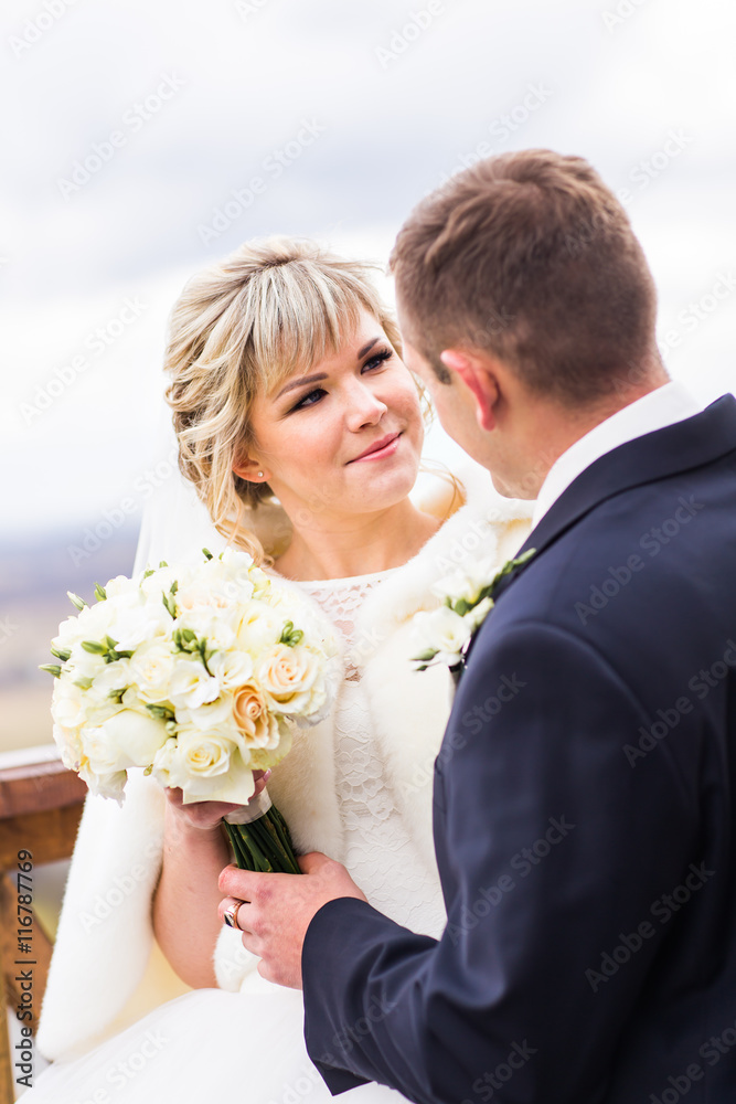 Happy couple in winter wedding day