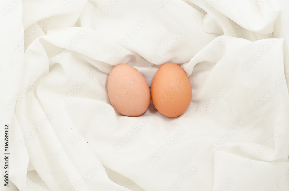 Eggs on fabric White.Chicken eggs on white fabric.easter eggs on fabric with copy space. Eggs on fabric White.Chicken eggs on white fabric.easter eggs on fabric with copy space.
