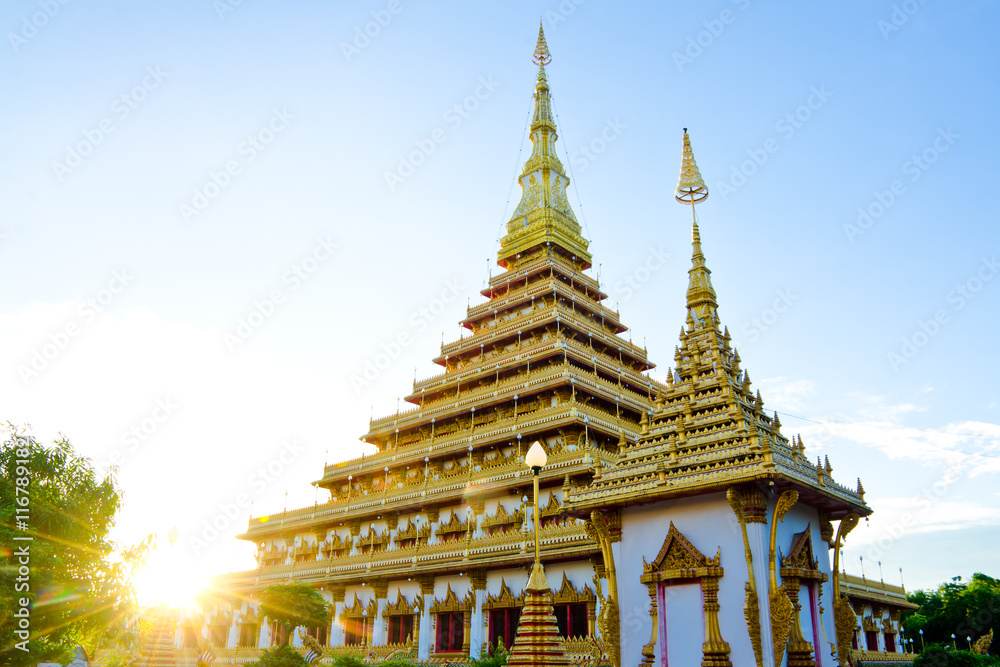 Naklejka premium Thailand Bhudda temple golden Stupa Khonkaen landmark,Temple Sunset in Khon Kaen, Thailand; Wat Nong Waeng (Temple),