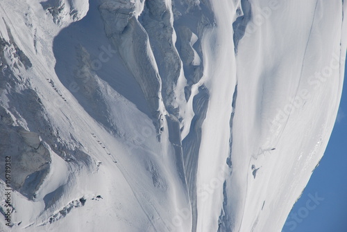 Swiss alps climbers in snow and ice photo