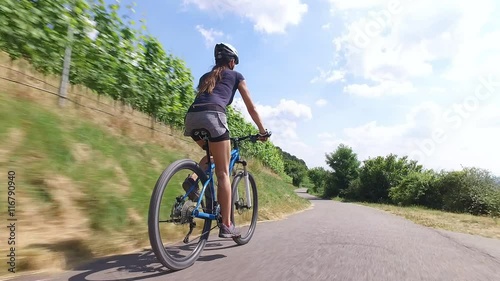Young woman riding her mountain bike