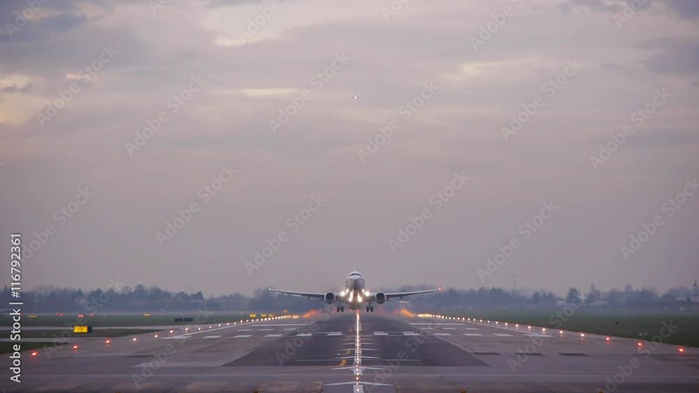 airplane taking off passing over head  at bologna airport,tracking shot,bologna airport 