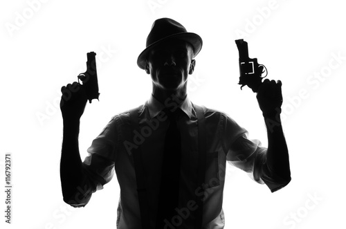 Silhouette of detective with two guns