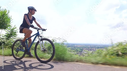 Young woman riding her mountain bike