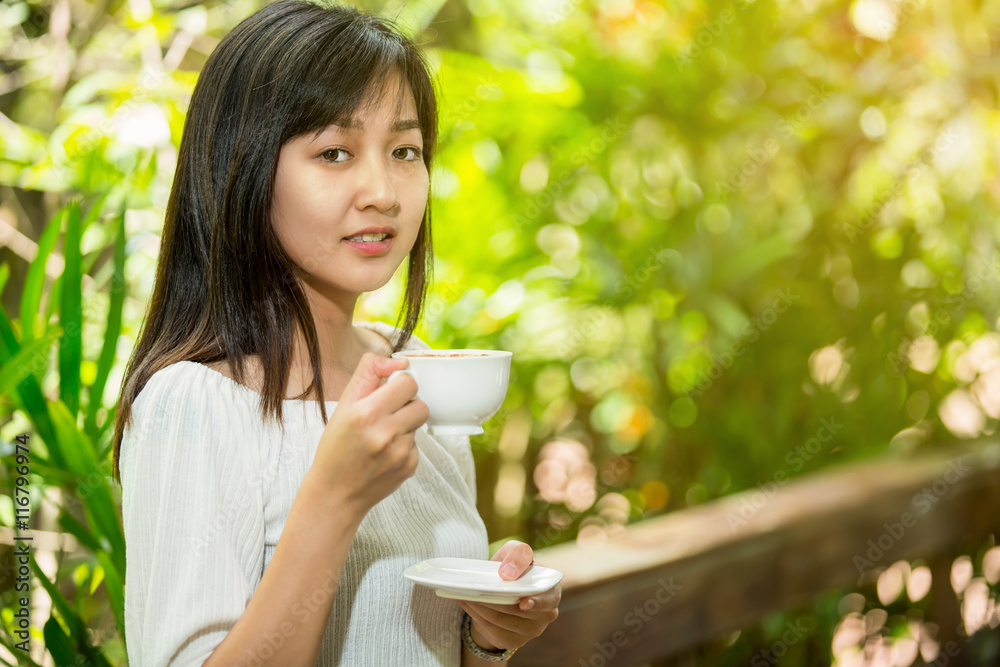 woman drinking coffee in the morning at restaurant woman drinking coffee in the morning at restaurant
