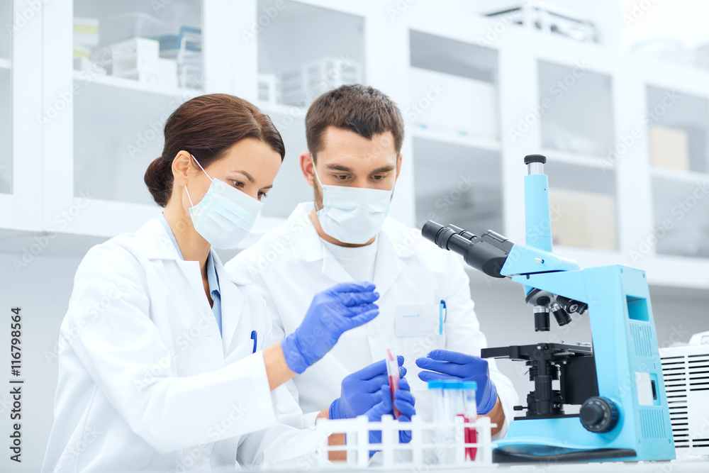 young scientists making test or research in lab young scientists making test or research in lab