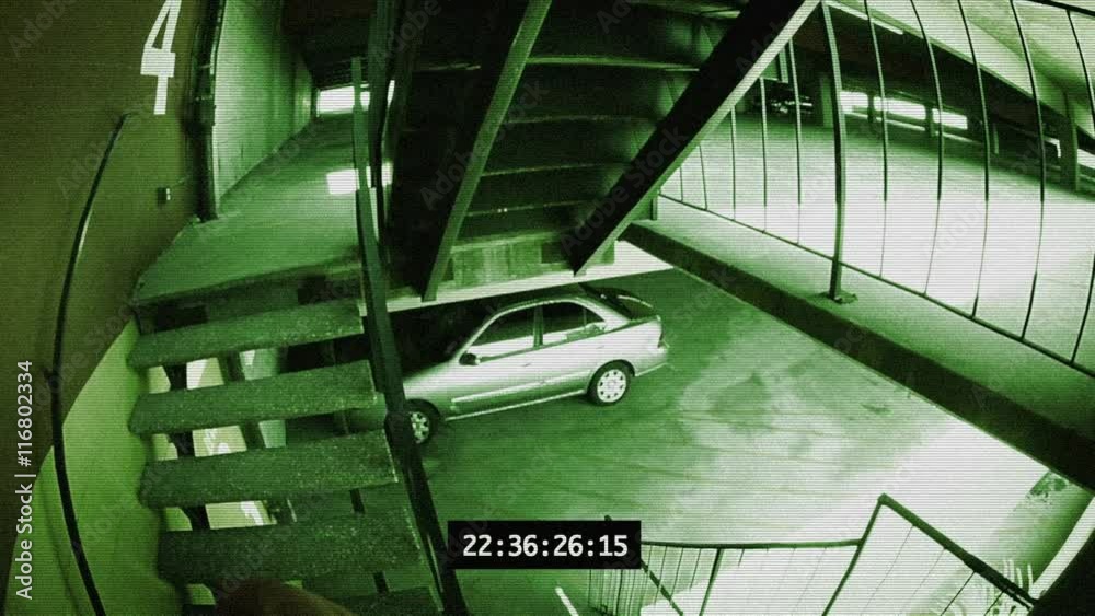 Security camera footage of a car being broken into.