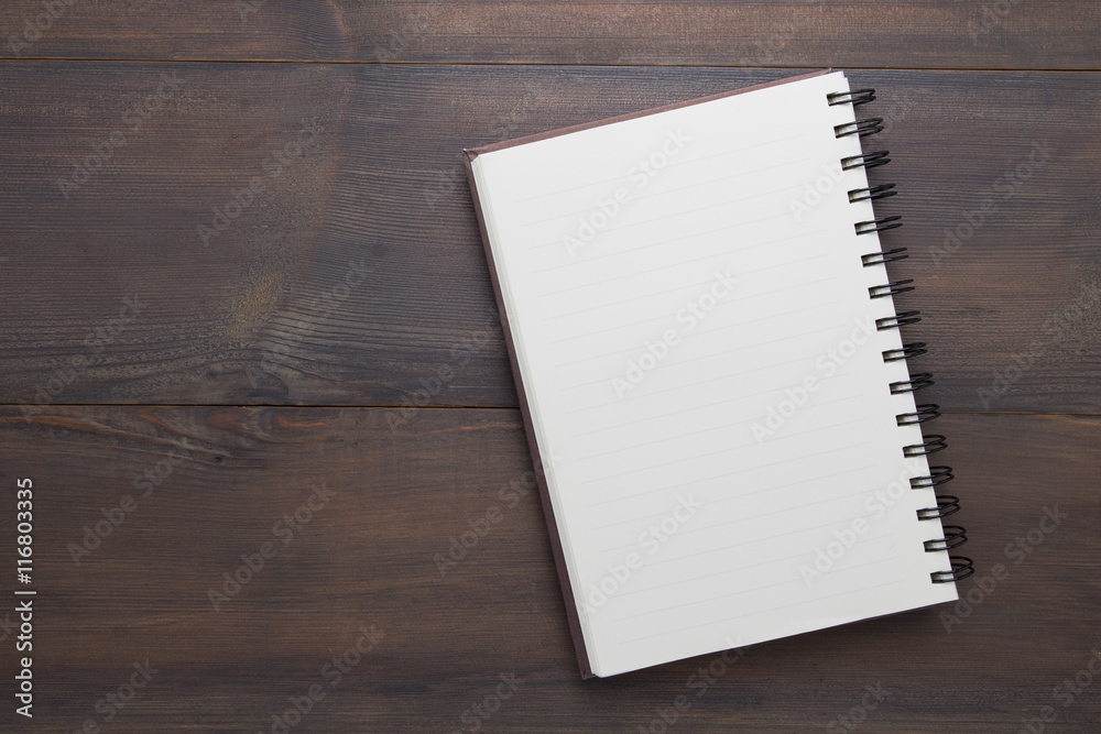 Empty notebook open on the table Empty notebook open on the table