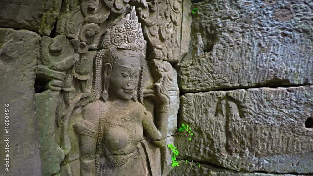 Ancient and crumbling relief sculpture of a Hindu deity on an exterior wall of Bayon Temple, near Siem Reap, Cambodia. 4k UltraHD video Ancient and crumbling relief sculpture of a Hindu deity on an exterior wall of Bayon Temple, near Siem Reap, Cambodia. 4k UltraHD video