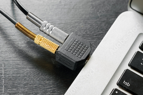 audio splitter is connected to a laptop