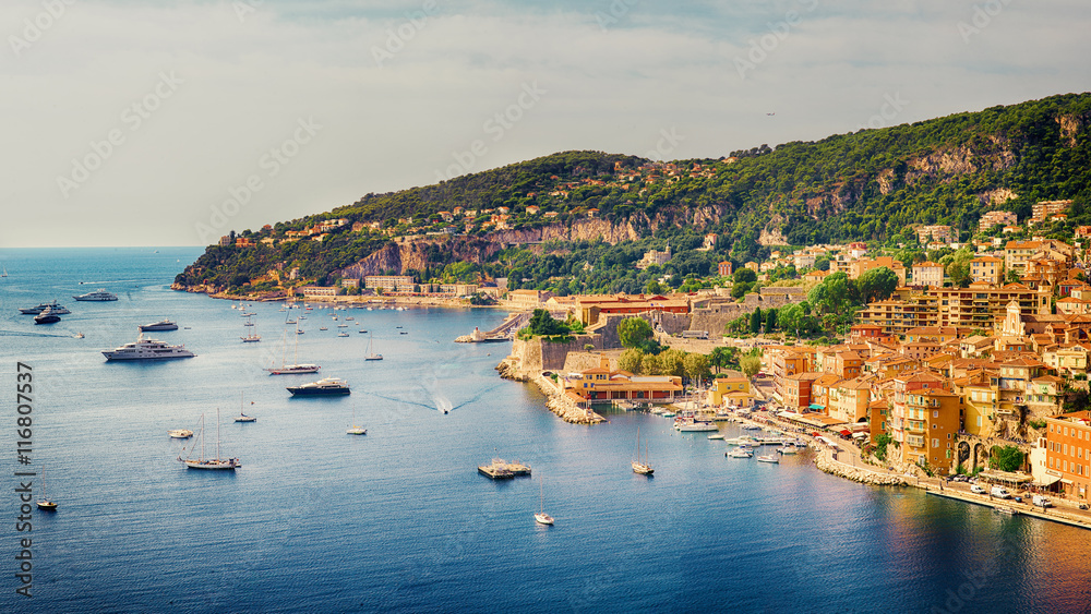 Villefranche-sur-Mer, France - 10 September, 2015: view of luxury resort and bay on sunny day. Villefranche-sur-Mer, french reviera, near Nice and Monaco