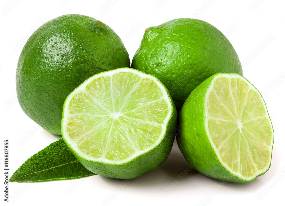 two limes with halves and leaf isolated on white background two limes with halves and leaf isolated on white background