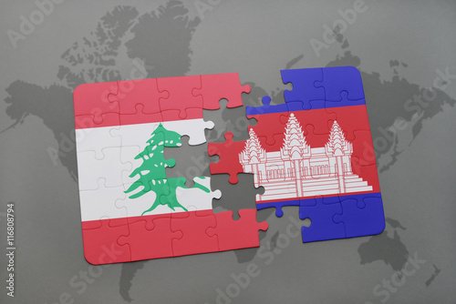 puzzle with the national flag of lebanon and cambodia on a world map background.