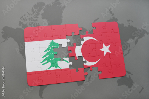 puzzle with the national flag of lebanon and turkey on a world map background.