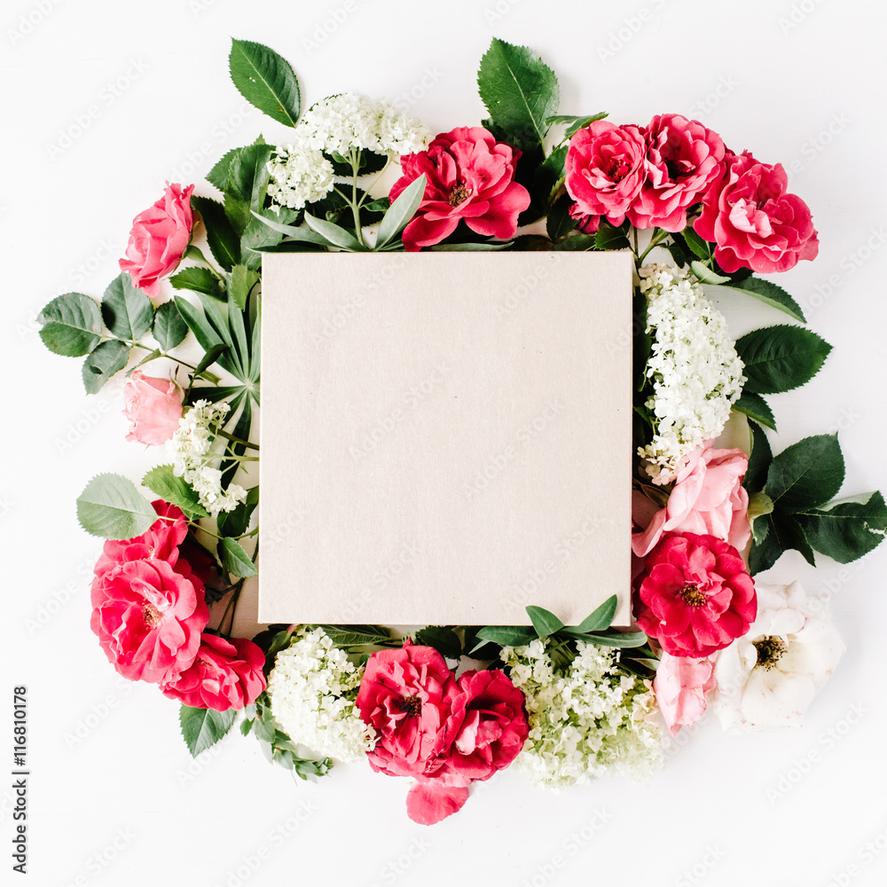 Fototapeta flat lay frame with craft box, pink roses, hydrangea, branches, leaves and petals isolated on white background. top view