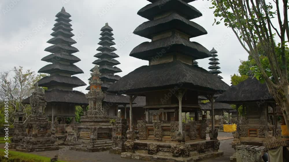 Hindu royal temple complex of Pura Taman Ayun, with its beautiful, tiered pagodas and intricate carvings, in Bali, Indonesia. FullHD footage Hindu royal temple complex of Pura Taman Ayun, with its beautiful, tiered pagodas and intricate carvings, in Bali, Indonesia. FullHD footage