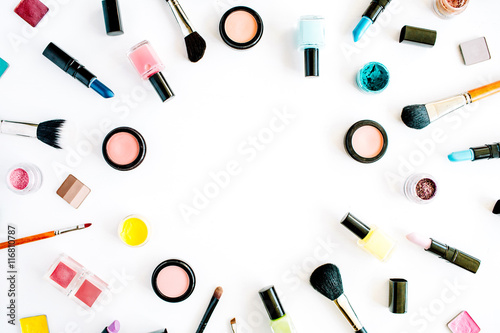 flat lay female cosmetics collage frame with lipstick, brush on white background. top view set