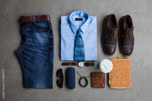 Men's fashion, casual outfits with accessories, flat lay, top view on gray grunge background