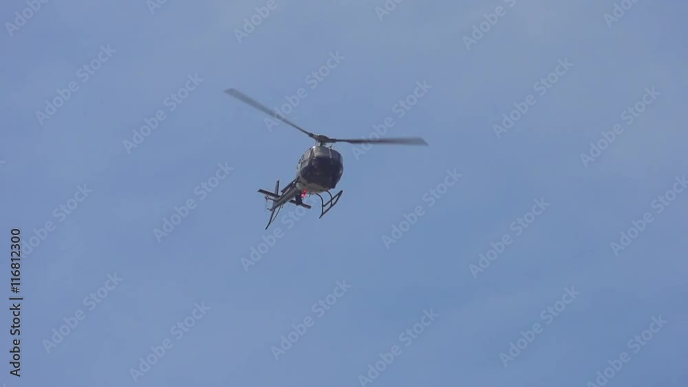 Police Helicopter flies overhead, Shot with a high speed camera. Police Helicopter flies overhead, Shot with a high speed camera.