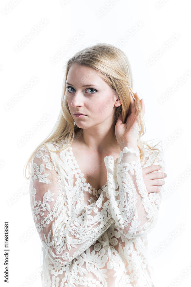 Beautiful Russian blonde girl on a white background in translucent blouse Beautiful Russian blonde girl on a white background in translucent blouse
