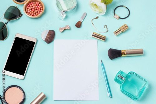 women's clothes on the turquoise background, layout female table