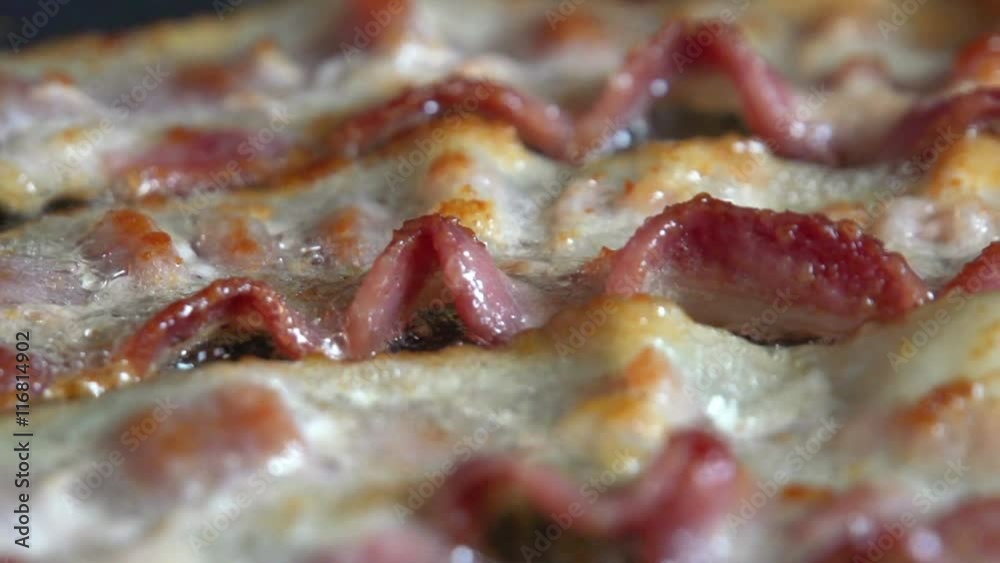 Dolly Macro shot of frying bacon (Mmmmmmm...bacon). Shot with a high speed camera.