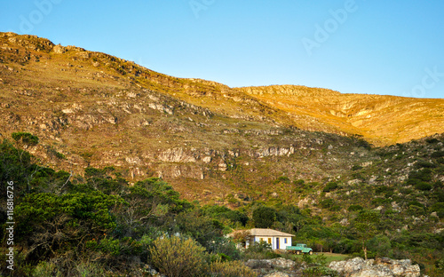 white house with green truck in a landscape of mountains, Lapinh photo