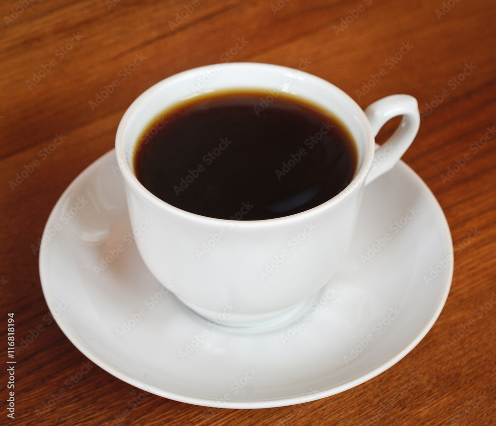 Cup of coffee on a wooden table