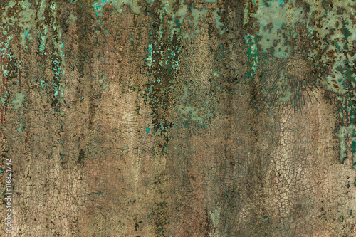 Old metal surface is covered with peeling green paint colors. background