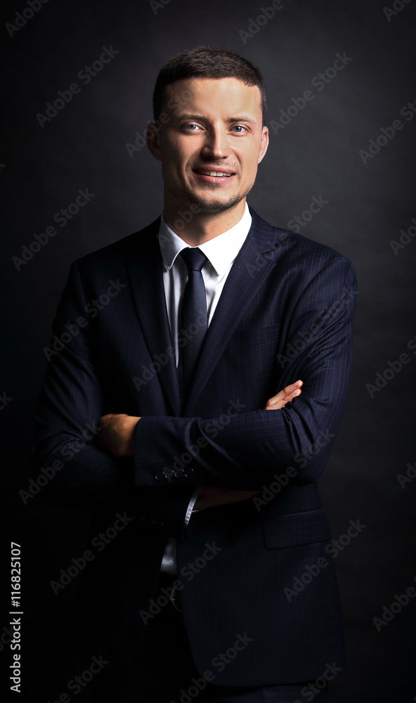 Close up portrait of a business man on black background Close up portrait of a business man on black background
