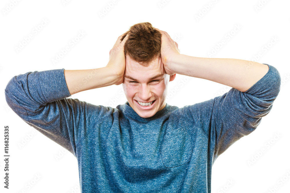 Closeup stressed man holds head with hands Closeup stressed man holds head with hands