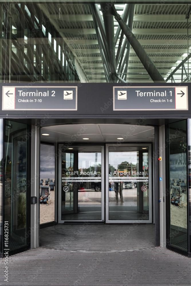 Entrance to the passenger terminal with check-in at the international airport Hamburg Germany