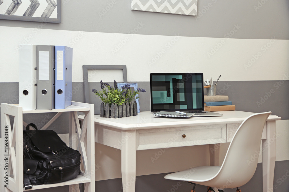 Stylish workplace with laptop at home Stylish workplace with laptop at home