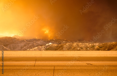 Wildfire in the mountains near freeway