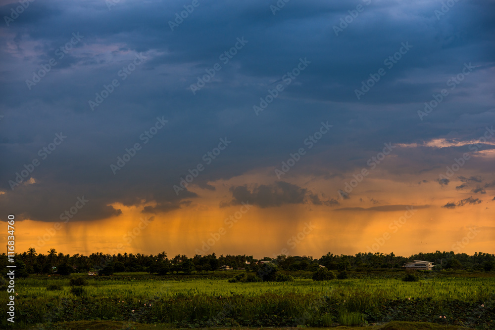 stunning sunset while raining. Low key, dark background stunning sunset while raining. Low key, dark background