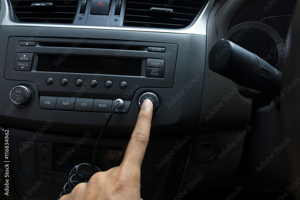 man hand use the signal switch. Car interior detail