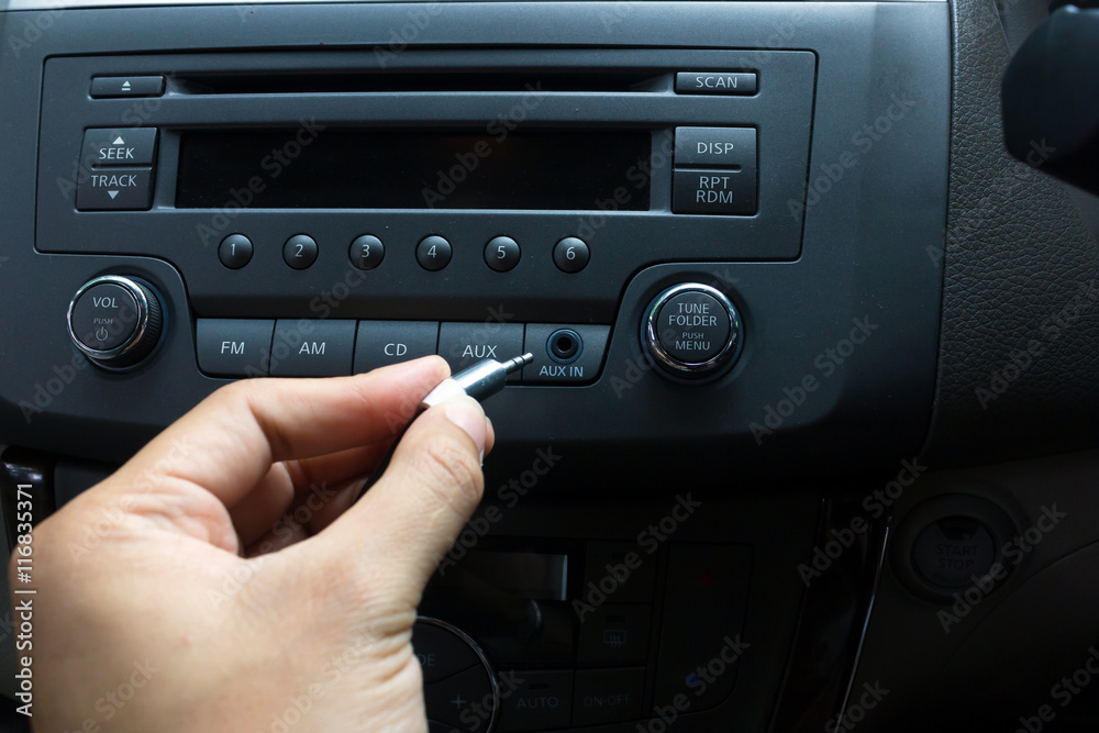 Fototapeta premium man hand use the signal switch. Car interior detail