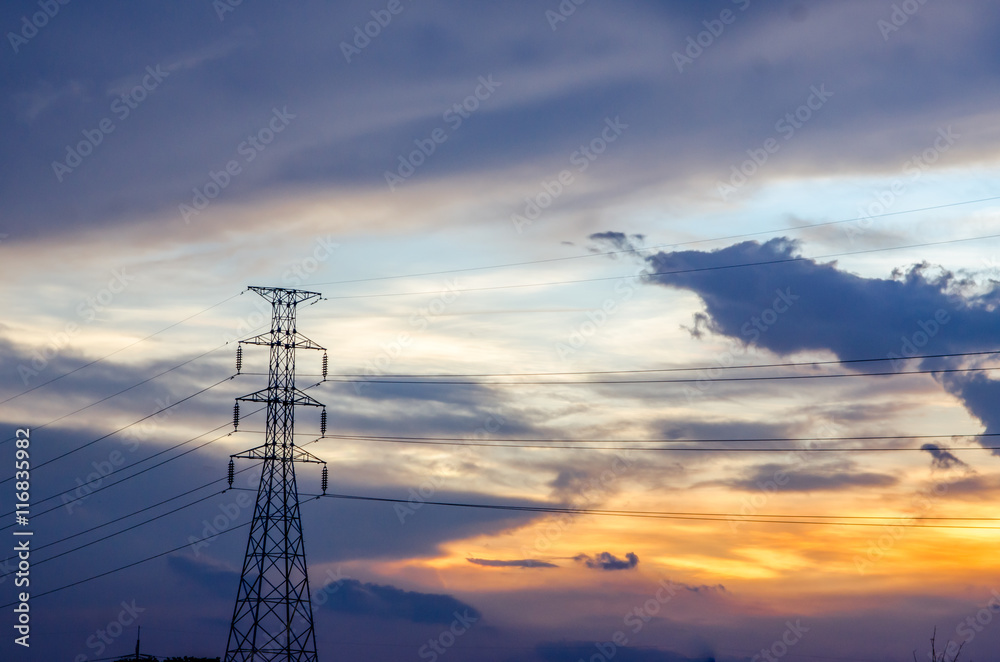 High voltage pole on sunset background