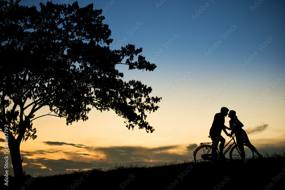 sillhouette couple love. kissing at beautiful sunset time.
