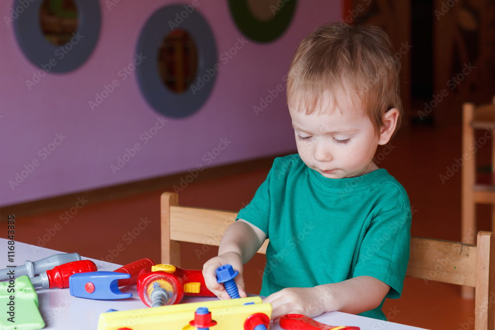 kid child boy playing with toys kid child boy playing with toys