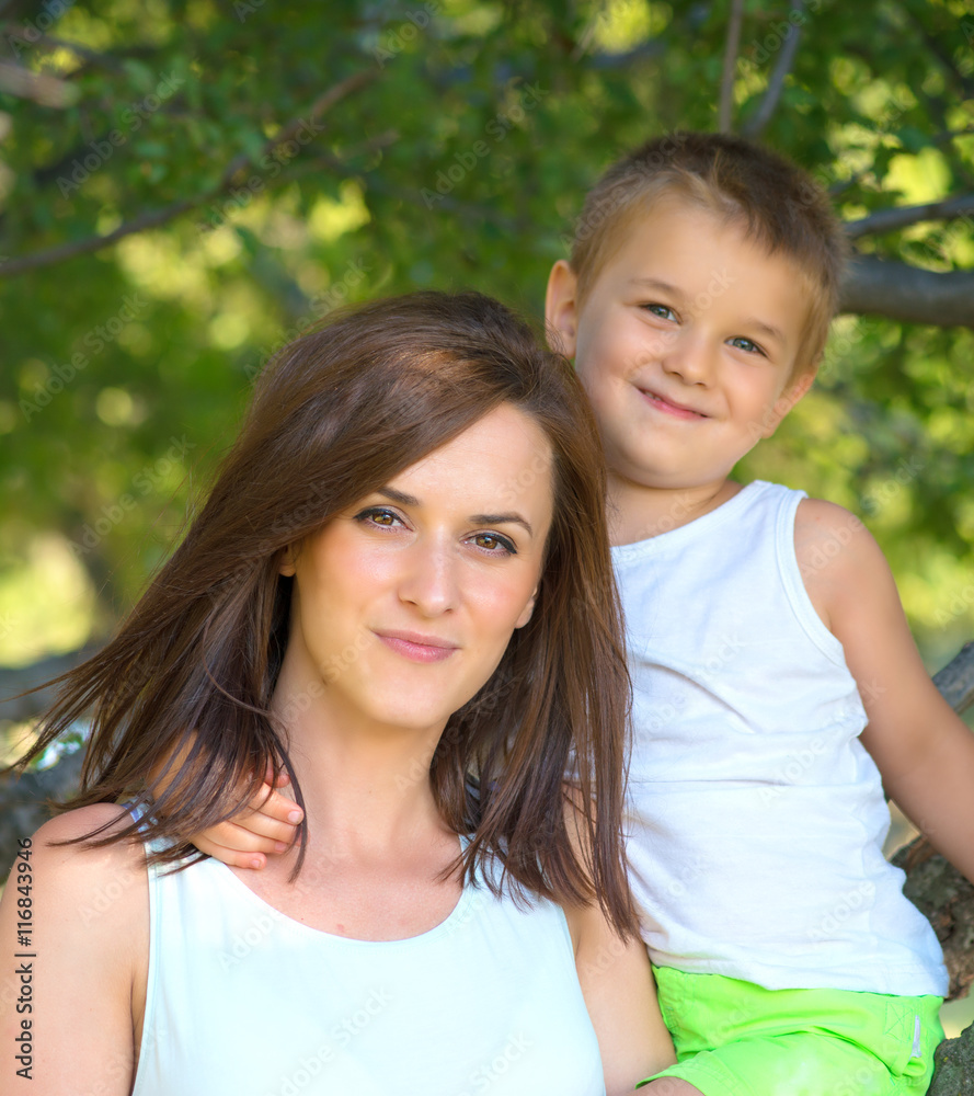 Obraz premium young mother and her son spending time outdoor on a summer day
