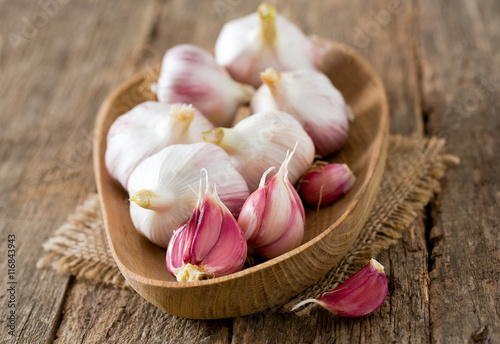 fresh garlic on wooden surface