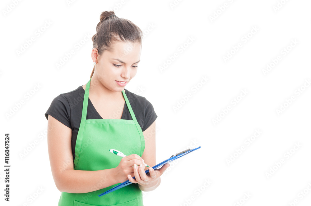Attractive female seller at work holding clipboard Attractive female seller at work holding clipboard