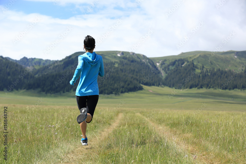 healthy lifestyle young fitness woman runner running on grassland healthy lifestyle young fitness woman runner running on grassland