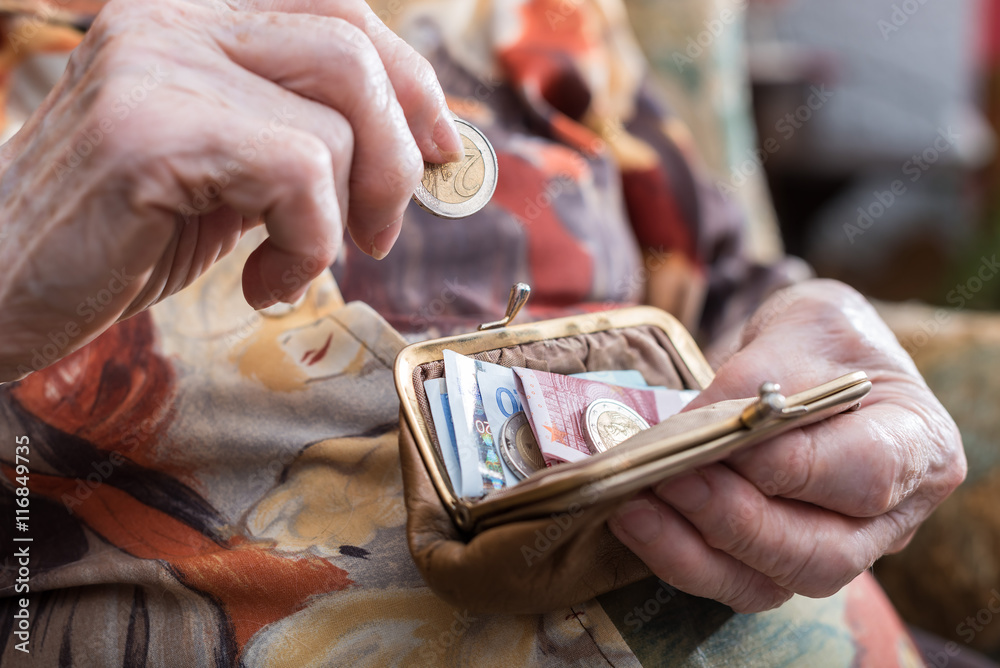 Old woman counting her money