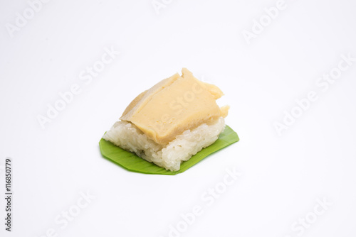 sticky rice with egg custard on green banana leaf. Thai dessert.