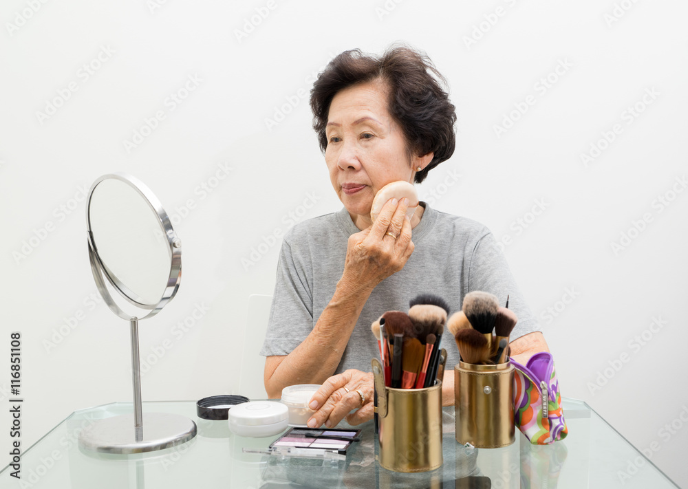 old woman applying make up,asian people, asian women old woman applying make up,asian people, asian women